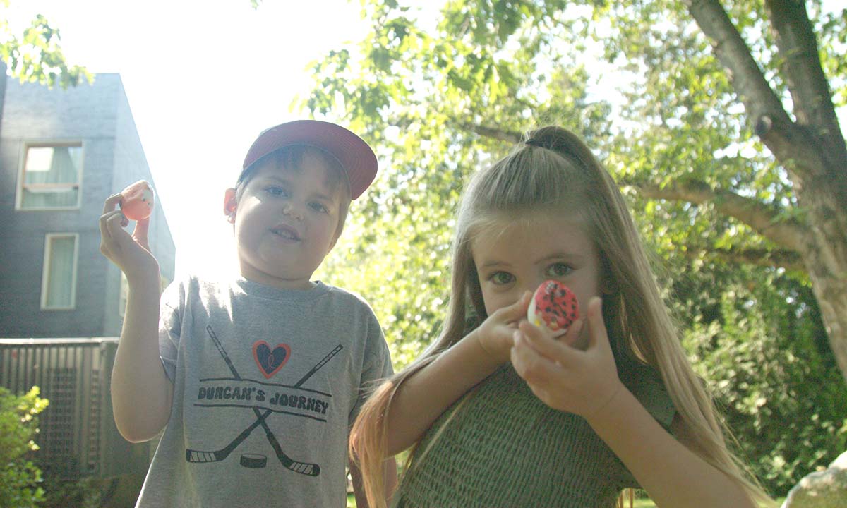 Siblings take a moment for play outside Ronald McDonald House BC & Yukon